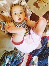 Close-up of cute baby girl at home