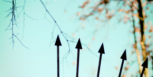 Low angle view of hanging lights against sky