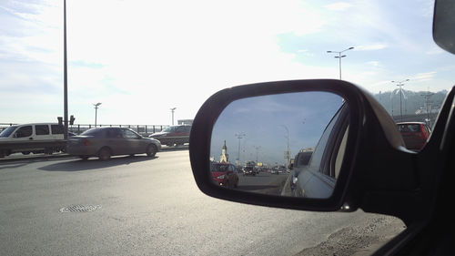 Cars on road against sky