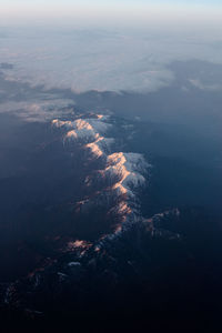 Aerial view of landscape and mountains against sky