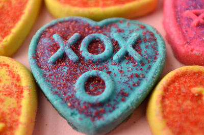 Xox means hugs and kisses on blue heart shape cookies for valentines day