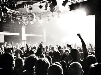 People enjoying music concert at night