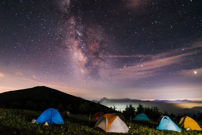 Scenic view of field against sky at night