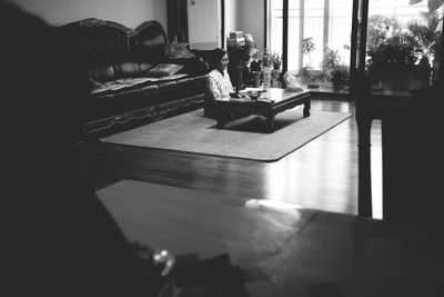 Man relaxing on sofa at home