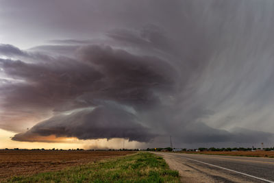 Storm clouds over field