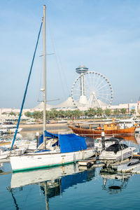 View of ferris wheel at harbor