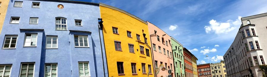 Low angle view of yellow buildings against sky