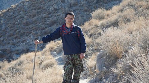 Young man standing on field