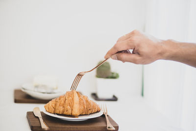 Midsection of woman holding ice cream in plate