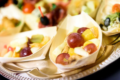 Close-up of fruits in bowl on plate