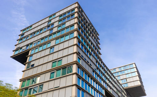 Low angle view of skyscraper against sky