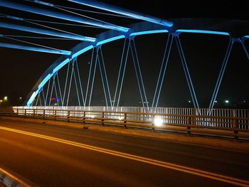 Light trails on suspension bridge at night