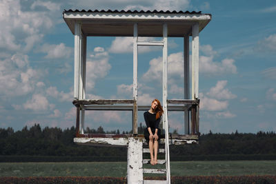 Silhouette of woman standing against sky