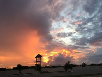 Scenic view of landscape against sky at sunset