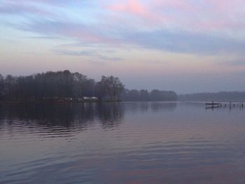 Scenic view of lake against sky during sunset