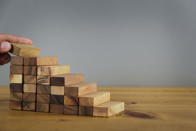 Person holding stack of table