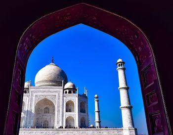 Low angle view of historical building against blue sky