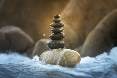 Close-up of stone stack on rock