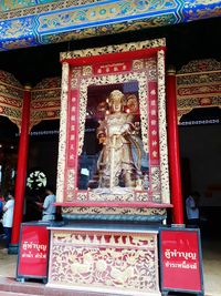 Low angle view of statue against temple