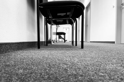Empty seats in corridor of building