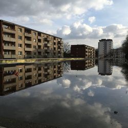 Reflection of buildings in puddle