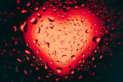 Full frame shot of wet glass window during rainy season