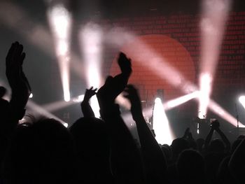 People enjoying music concert at night