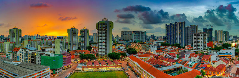 High angle view of buildings in city against sky