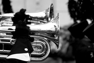 Cropped hands of people playing trumpets