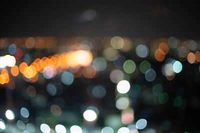 Defocused image of illuminated lights at night