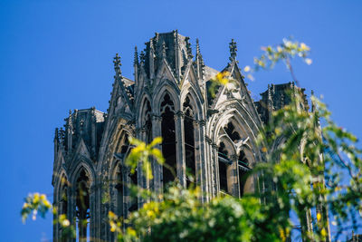 Low angle view of traditional building against blue sky