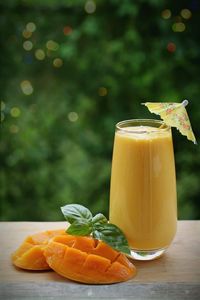 Close-up of orange juice on table