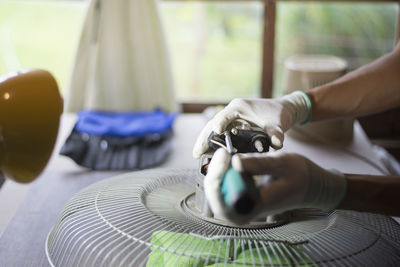 Close-up of man working on table