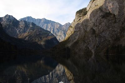 Scenic view of lake and mountains against sky