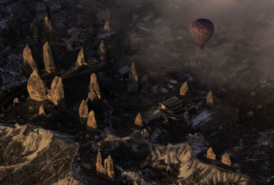 Aerial view of rock formations in town during sunset