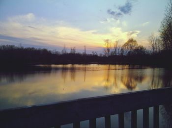 Scenic view of lake at sunset