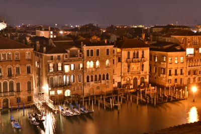 Buildings in city at night