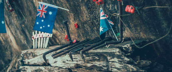 Close-up of damaged flag on wall