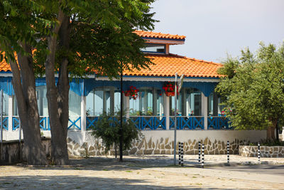 Exterior of building and trees against sky