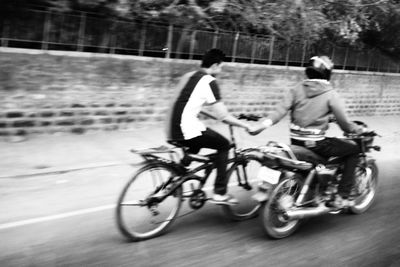 Man cycling on road