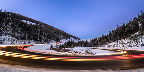 The lights from cars a blurred as the speed along  berthoud pass, winter park, colorado