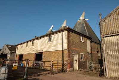 Exterior of old building against clear blue sky