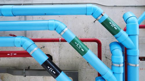 High angle view of text on blue pipe