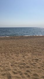 Scenic view of beach against clear sky