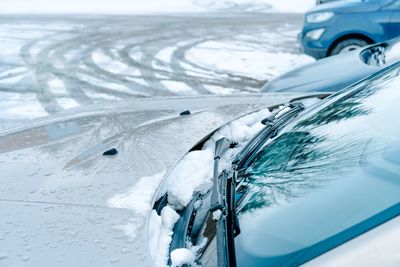 Windshield wiper in a snowy winter day