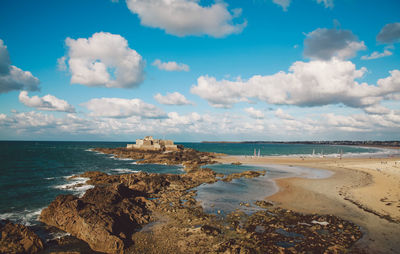 Scenic view of beach and sea against sky