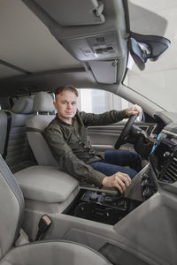 Portrait of man driving car