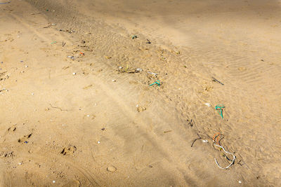 High angle view of wet sand on beach