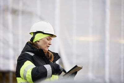 Female engineer at building site