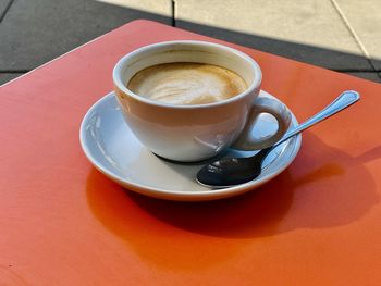 High angle view of coffee cup on table